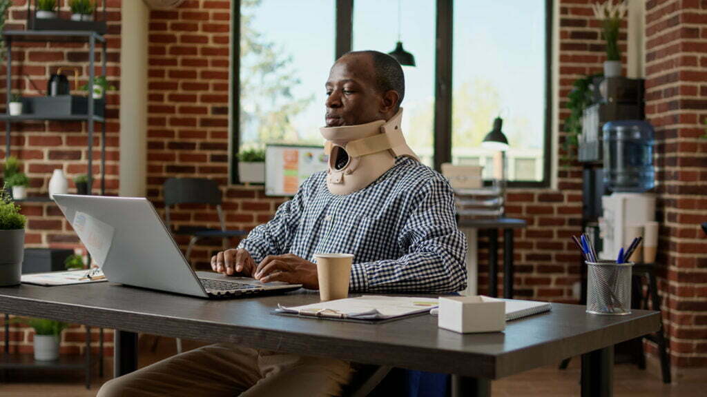 Hours of Work Needed for Social Security Disability: How Much Is Required? African American Businessman Wearing Medical Cervi 2022 07 12 22 40 15 Utc 1024x576