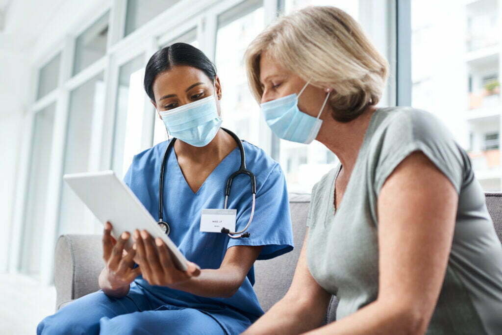 47969862 Knowledge Makes A Difficult Process Much More Easier A Young Doctor Using A Digital Tablet During A Consultation With A Senior Woman 1024x683