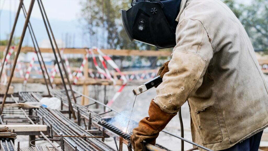 What is Considered Suitable Employment? A Worker At Construction Site Is Welding Iron Pipe 2022 11 17 16 00 04 Utc 1024x576