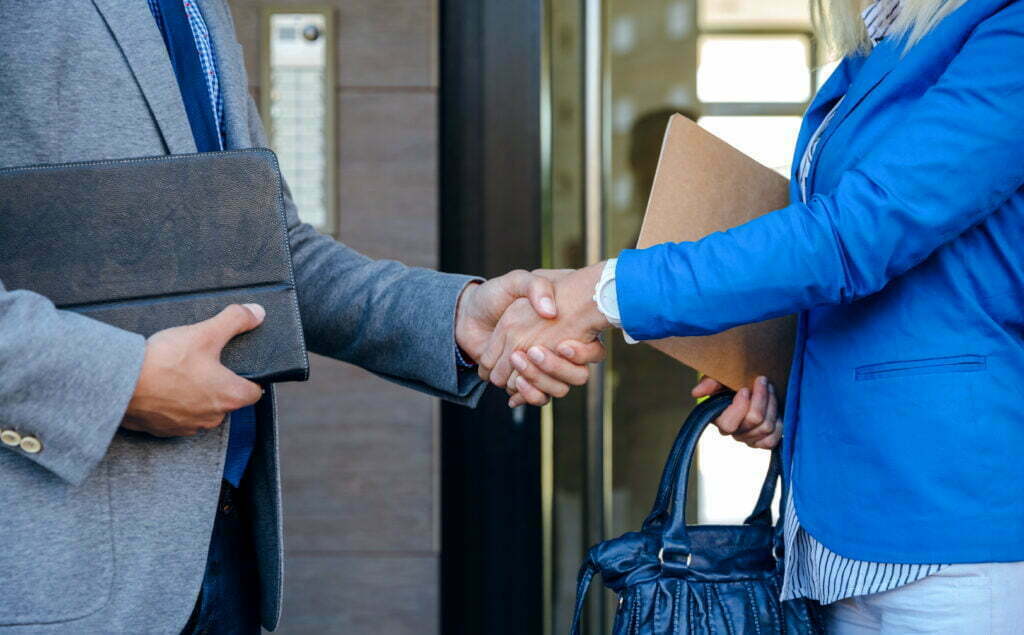Can I (or Should I) Change Lawyers? Businessman And Businesswoman Giving A Handshake 2021 08 30 05 21 47 Utc 1024x635
