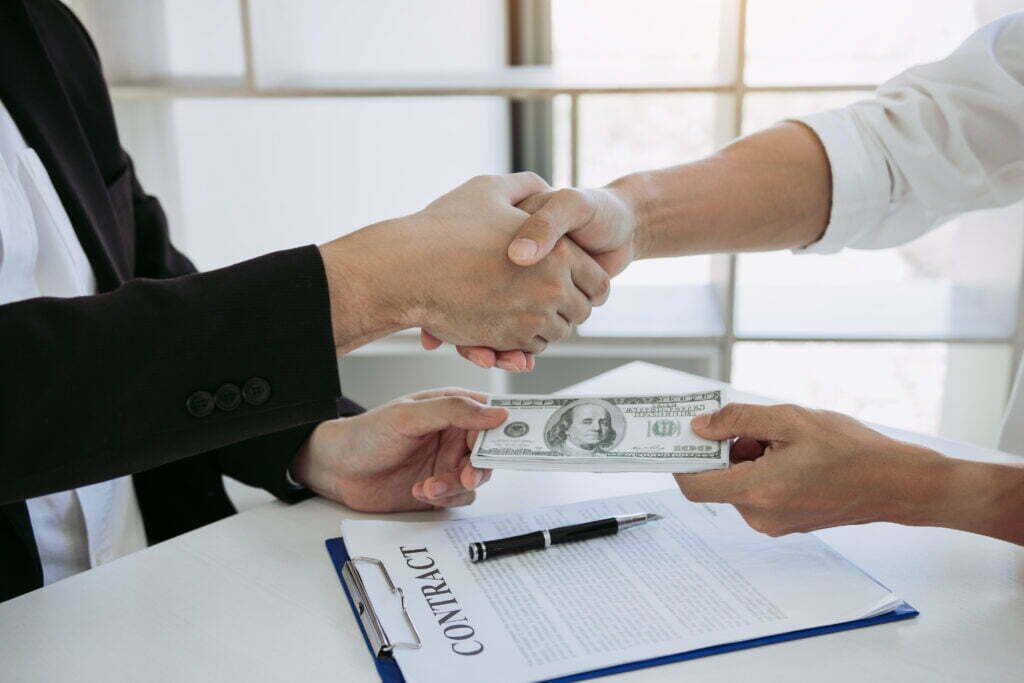 Wouldn’t I Get More Money if I Did Not Hire an Attorney? Corporate Businessmen Shaking Hands While One Man 2022 12 16 03 44 10 Utc 1024x683