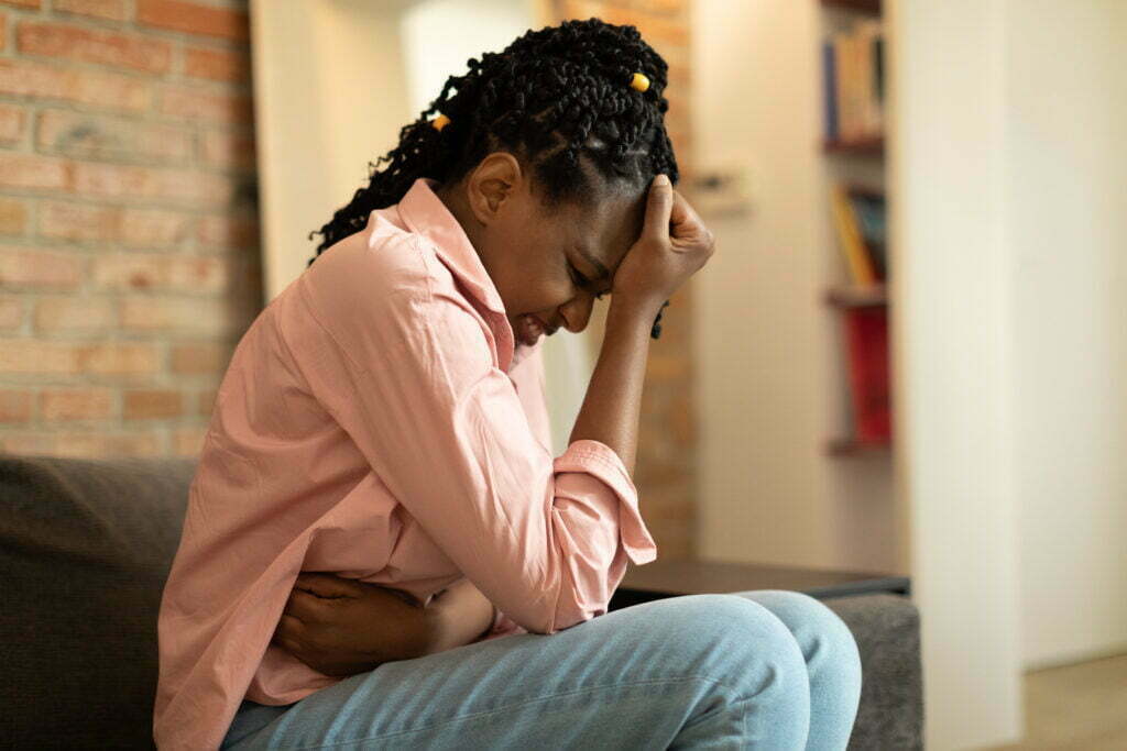 My Employer and the Insurance Company Put Me Through the Ringer. Do I Get Money for Pain and Suffering Under Workers' Compensation? African American Woman Suffering From Pms And Mens 2023 03 08 20 14 29 Utc 1024x683