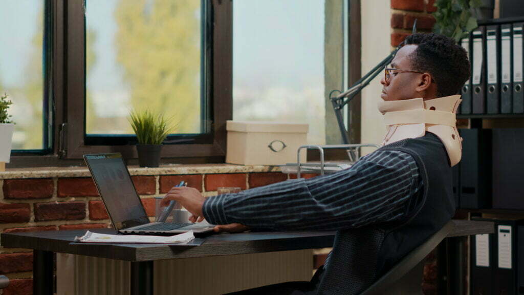 Business Man Wearing Cervical Neck Collar At Work 2022 04 11 18 32 48 Utc 1024x576