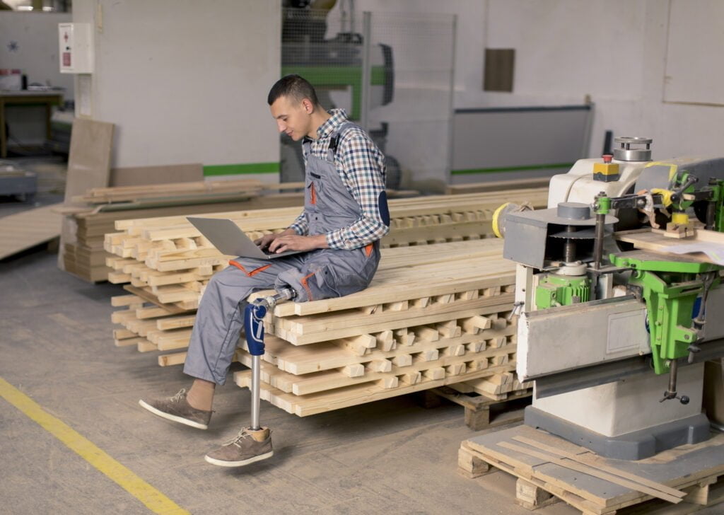 Workers’ Comp Tip of the Day: Being Placed on Light Work Duty After an Injury at Work Disabled Young Man With An Artificial Leg Is Worki 2022 04 04 22 01 25 Utc 1024x728