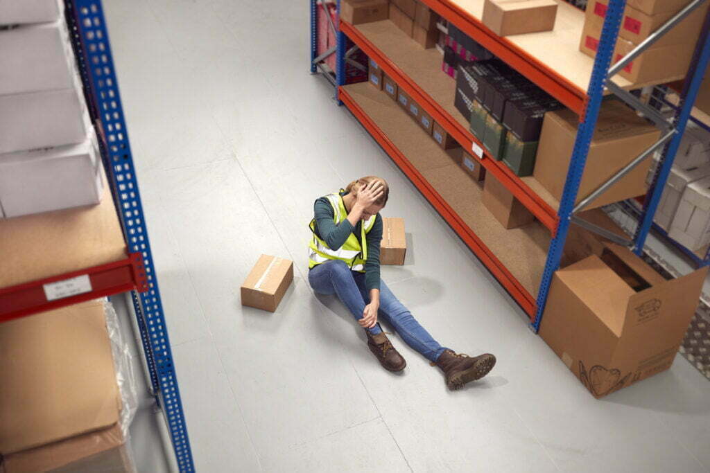 Can You Still Get Workers' Comp If You Were at Fault for Your Injury? Female Worker With Injured Leg On Floor After Work 2022 03 17 14 56 49 Utc 1024x683