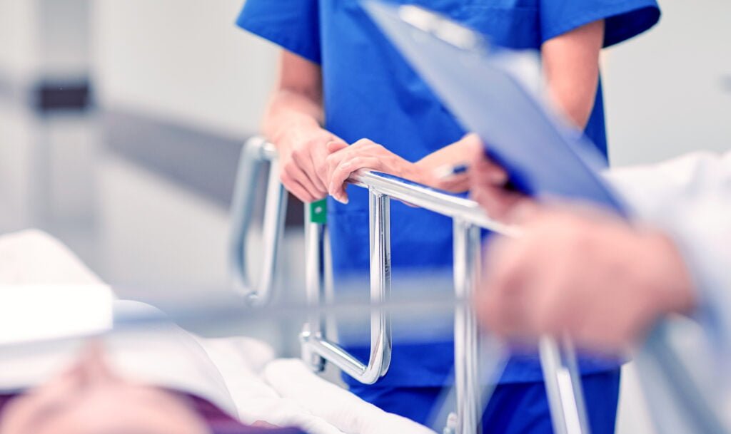 Prevalence of Workplace Injuries for Healthcare Professionals: How Workers’ Comp Can Help Medics And Patient On Hospital Gurney At Emergency 2022 12 16 09 46 42 Utc 1024x609