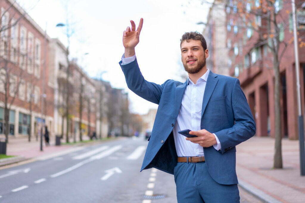 Businessman Or Finance Man Calling A Taxi To Go To 2023 01 10 16 36 46 Utc 1024x683