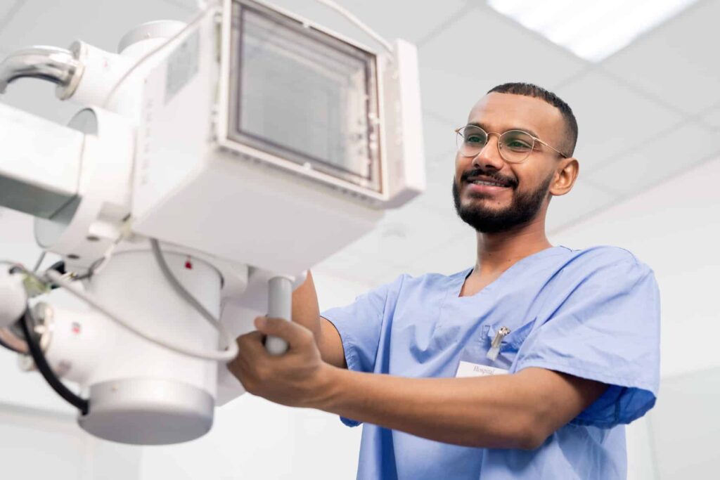 The Adjuster is Not Approving the Test Ordered by the Doctor. Why? Doctor In Blue Uniform And Eyeglasses Using Or Tes 2021 09 24 01 18 39 Utc 1024x683