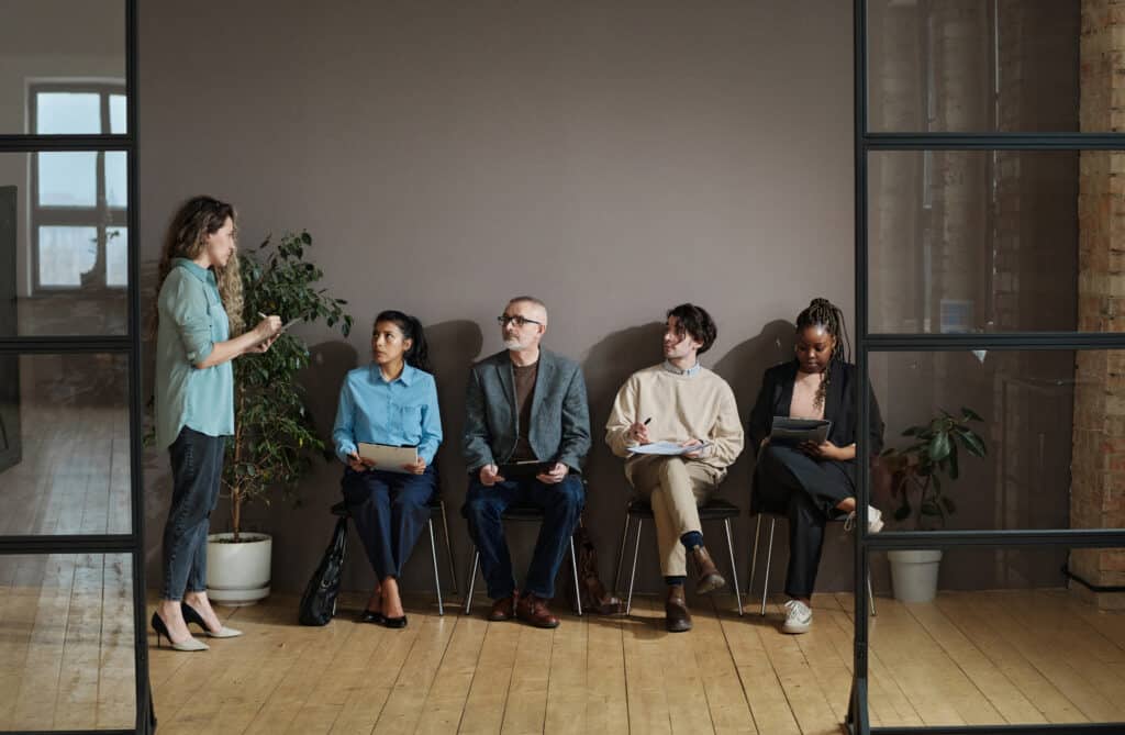 Understanding Workers' Comp as a Temp Agency Employee People Sitting At Employment Agency 2022 04 27 01 50 54 Utc 1024x669