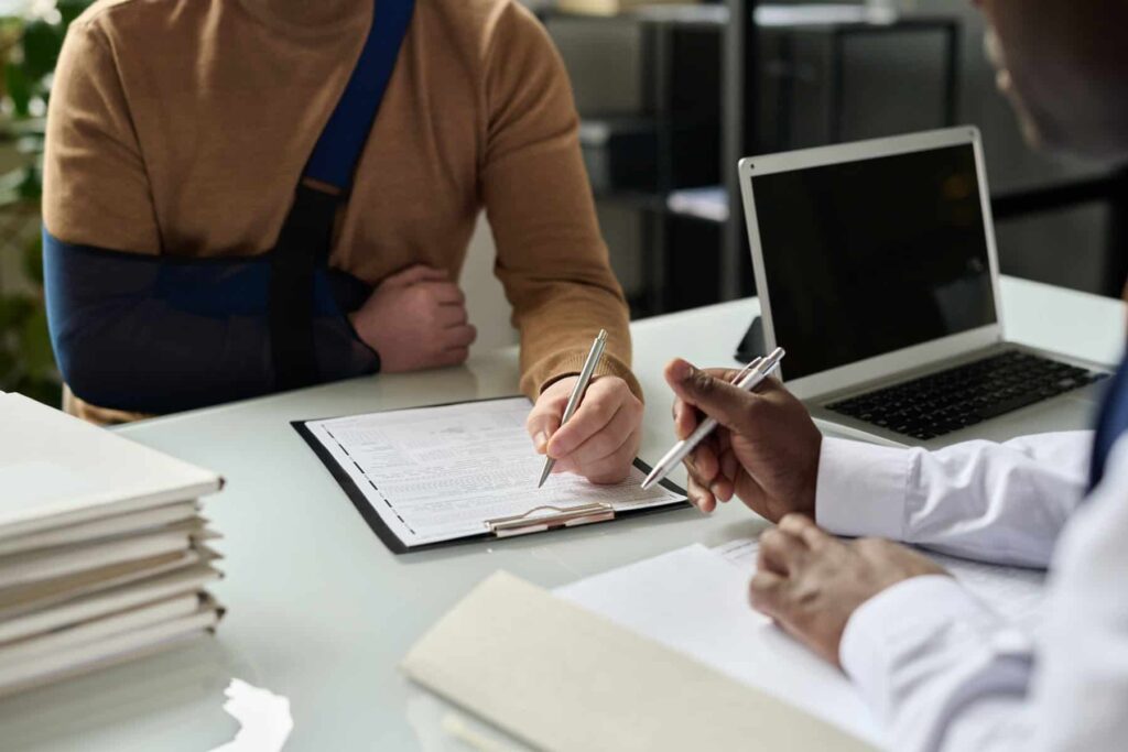 Close Up Of Man Filling In Medical Insurance Form 2022 12 19 08 43 51 Utc 1024x683