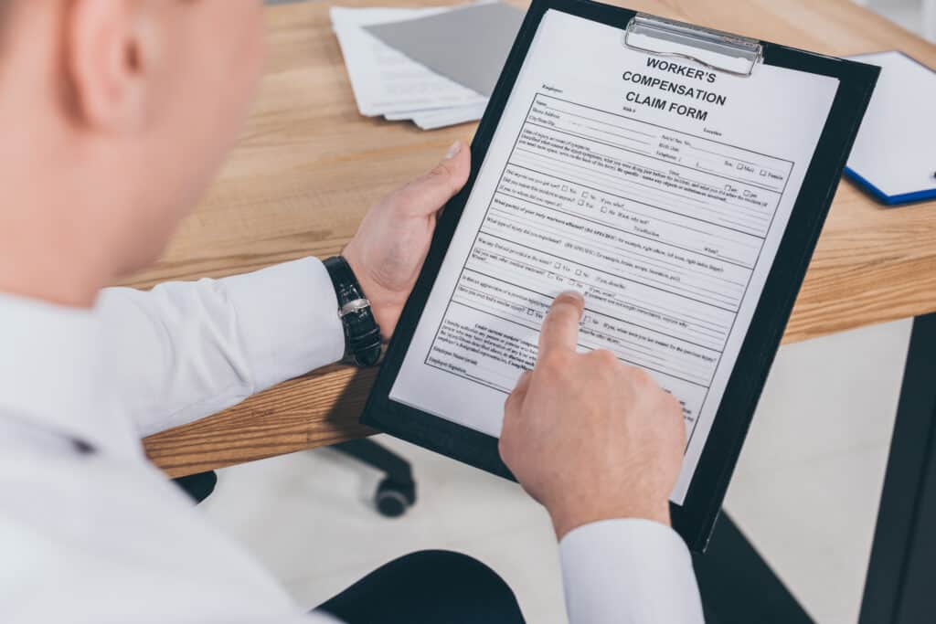 What is so Important About a Form 18 in Workers' Compensation? Cropped View Of Businessman Reading Compensation C 2023 04 22 04 33 56 Utc 1024x683